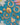 Gold antique jewellery laid upon a Turquoise background with white flowers