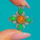 Silver spiral cross pendant with orange Fire Opal and green Chrysoprase